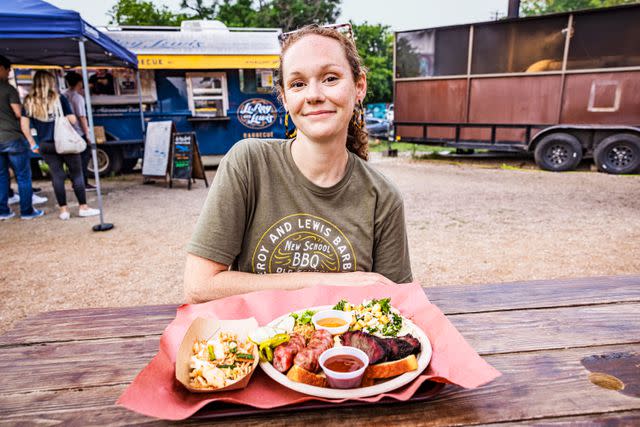 <p>Robbie Caponetto</p> Sawyer Lewis sits outside her Austin barbecue truck.