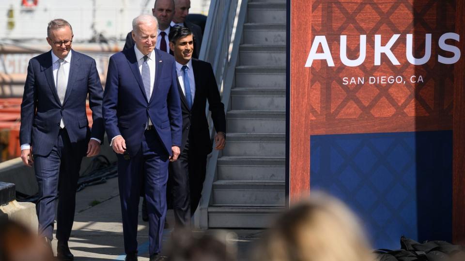 From left, Australian Prime Minister Anthony Albanese, U.S. President Joe Biden and British Prime Minister Rishi Sunak arrive for a news conference after a trilateral meeting during the AUKUS summit on March 13, 2023, in San Diego, Calif. (Leon Neal/Getty Images)
