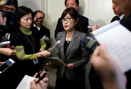 Japan's Defense Minister Tomomi Inada (C) speaks to the media after reports on North Korea's missile launch, at the parliament building in Tokyo, Japan, March 6, 2017. REUTERS/Issei Kato