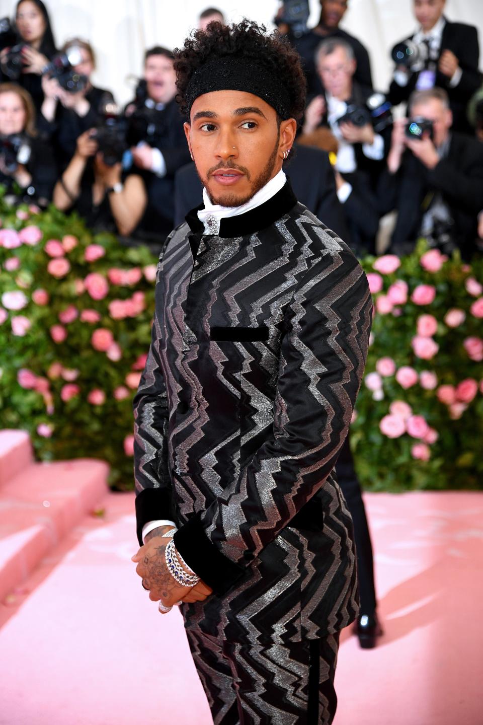 <h1 class="title">Lewis Hamilton in Tommy Hilfiger with Alex Soldier brooches</h1><cite class="credit">Photo: Getty Images</cite>