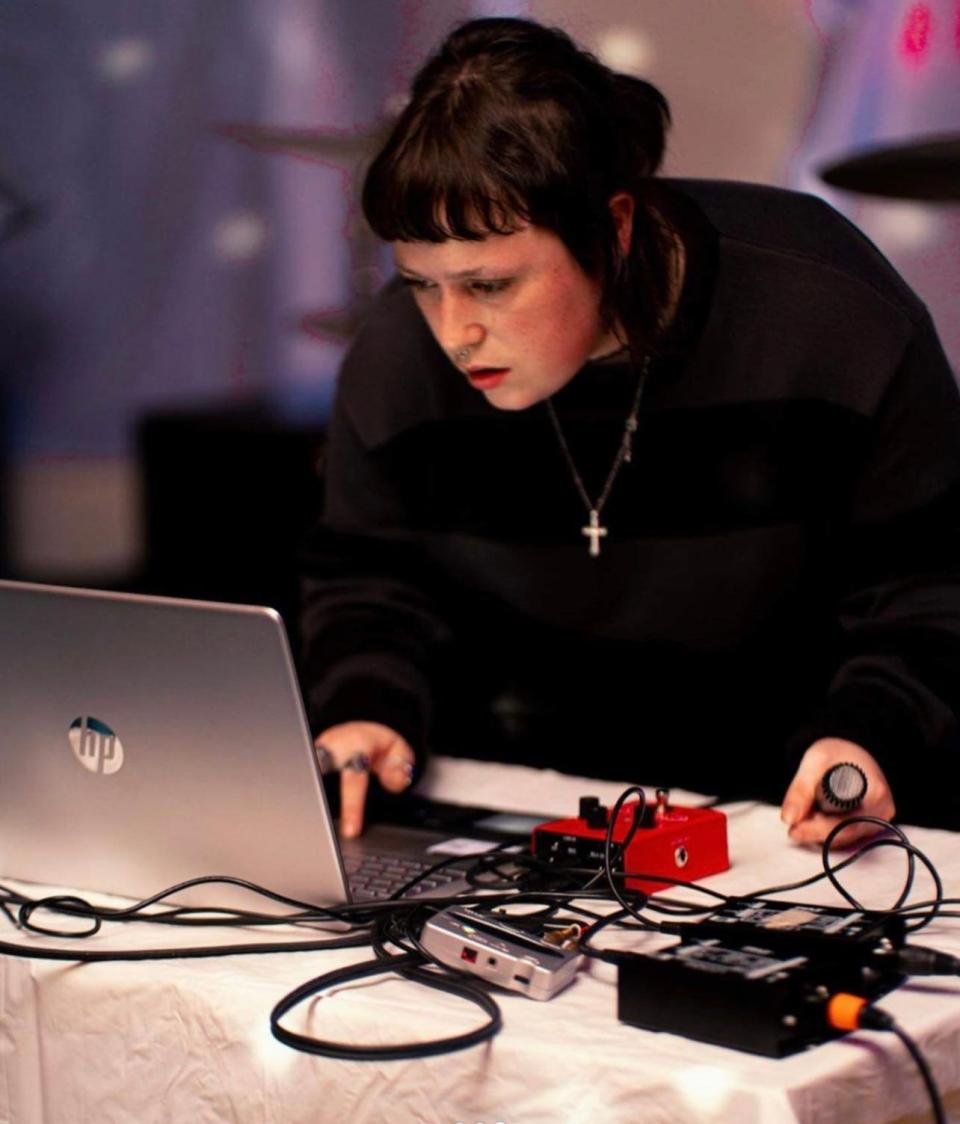 Houma-based electronic musician Grace Sarre creating music with her soundboard and laptop.