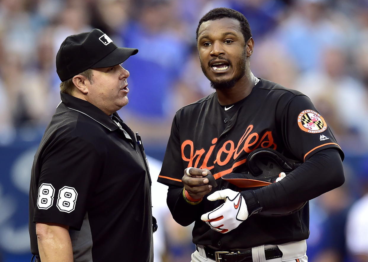 Adam Jones (right) and several of his Orioles teammates had a night they'll never forget after being in an elevator for 30 minutes following a loss to in Toronto. (AP)