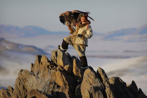 An eagle hunter in the Altai Mountains - Credit: Timothy Allen/Getty