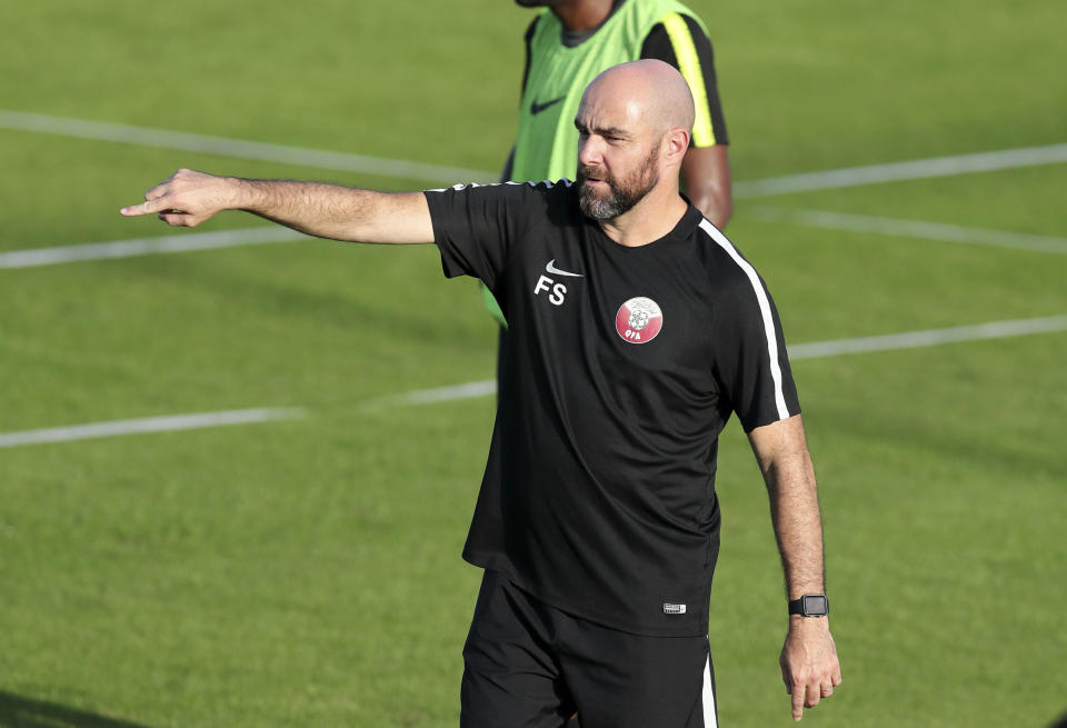 Qatar's coach Felix Sanchez gives instructions to his players during a practice session in Porto Alegre, Brazil, Saturday, June 22, 2019. Qatar will face Argentina on June 23 in a Copa America Group B soccer match. (AP Photo/Edison Vara)