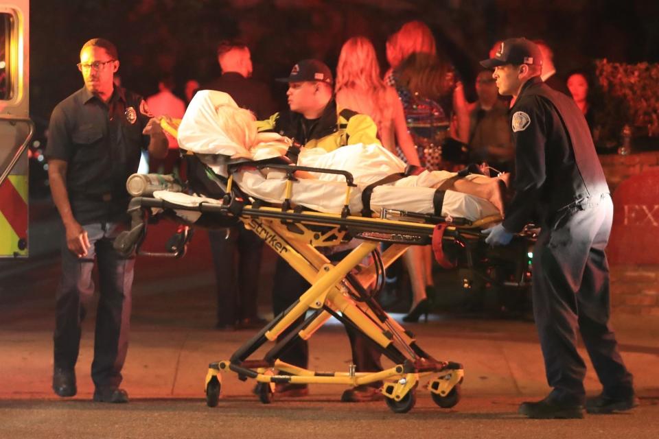 Photos of a blonde, that The Blast reports is Tammy Hembrow, being stretchered away from the party have emerged. Source: Backgrid