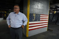 Richard Hansen, a Navy veteran and the Army commander's representative at the Scranton Army Ammunition Plant pauses during a tour of the manufacturing process of 155 mm M795 artillery projectiles, Tuesday, Aug. 27, 2024, in Scranton, Pa. (AP Photo/Matt Slocum)