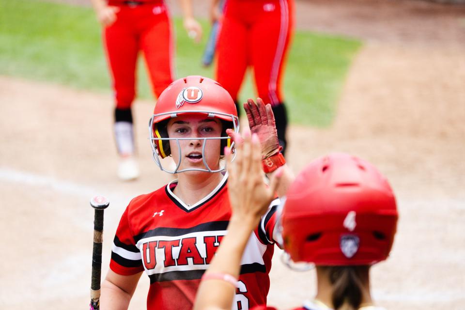 Utah catcher Emily Capobianco (6) high-fives a teammate during the third game of the NCAA softball Super Regional between Utah and San Diego State at Dumke Family Softball Stadium in Salt Lake City on Sunday, May 28, 2023. | Ryan Sun, Deseret News