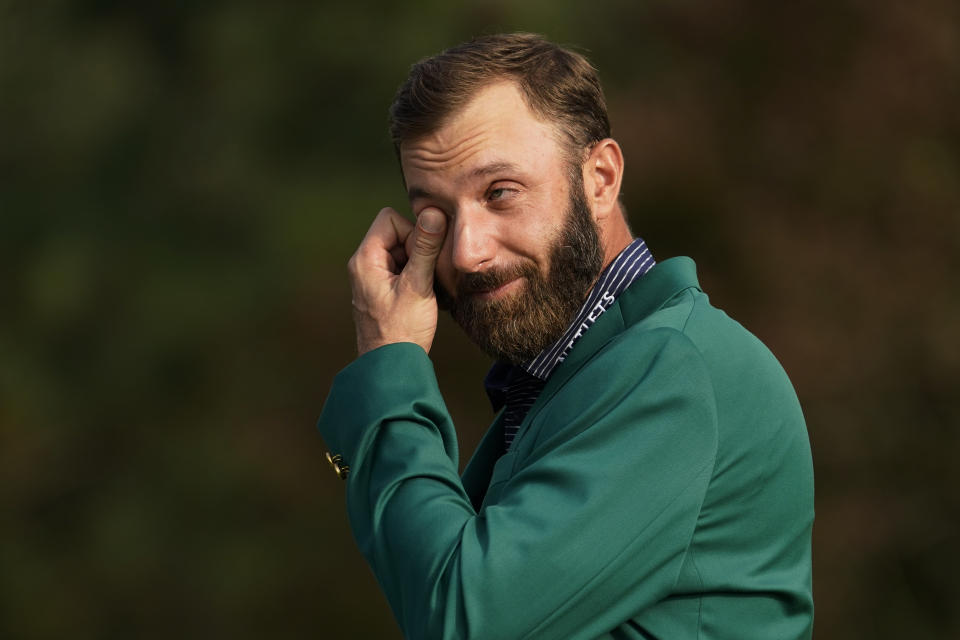 Masters golf champion Dustin Johnson wipes away a tear while being interviewed following his victory Sunday, Nov. 15, 2020, in Augusta, Ga.(AP Photo/David J. Phillip)