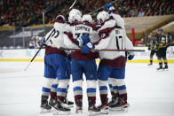 Colorado Avalanche celebrate after left wing J.T. Compher (37) scored against the Vegas Golden Knights during the third period of an NHL hockey game Monday, May 10, 2021, in Las Vegas. (AP Photo/John Locher)