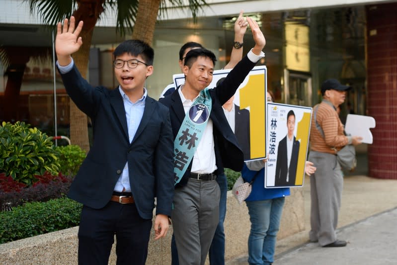 Joshua Wong campaigns for Kelvin Lam, a candidate in Sunday’s district council elections in Hong Kong