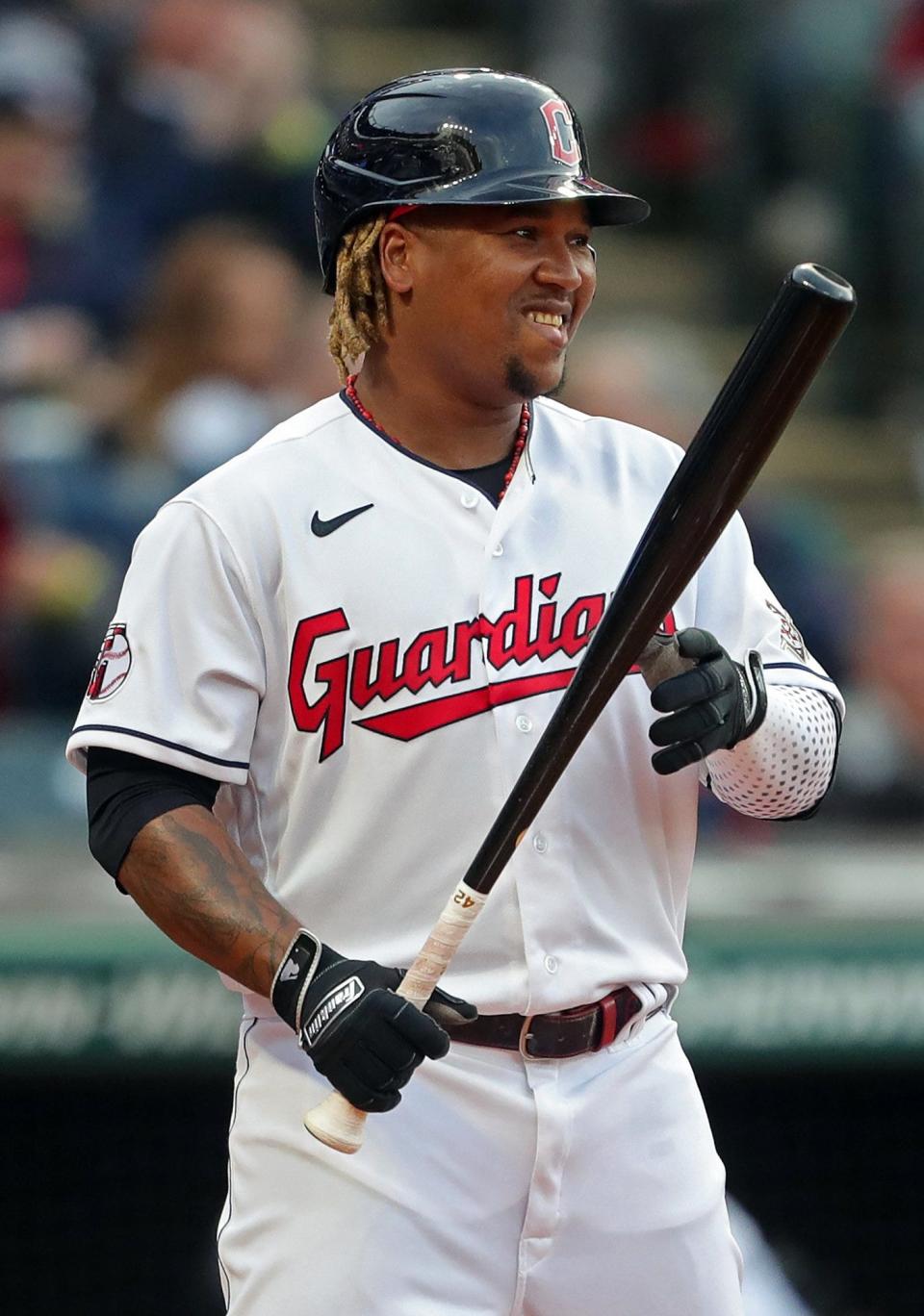 Guardians third baseman Jose Ramirez (11) smiles as he steps into the batters box during the first inning of Friday night's home opener against the San Francisco Giants. The Giants won 4-1. [Jeff Lange/Beacon Journal]