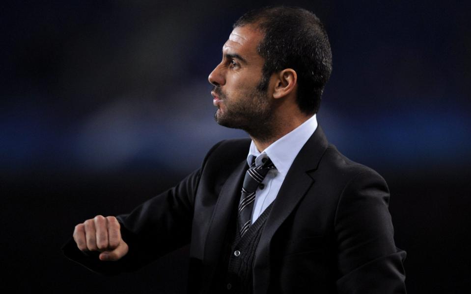 Pep Guardiola in suit - GETTY IMAGES