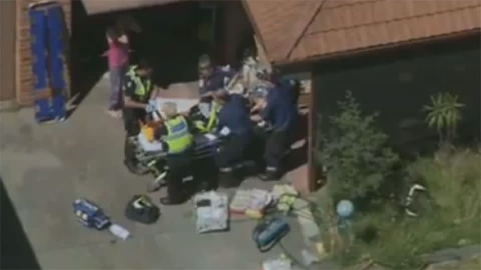 Police and paramedics remove a man from a Seaford home after he was stabbed. Photo: 7News