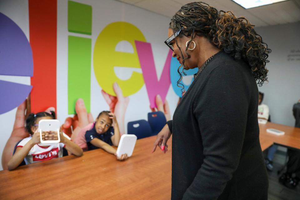 President and CEO Monique Marks talks with girls in the Genuinely Loving and Accepting Myself Movement class (GLAM) at the Franklin Wright Settlements after-school enrichment program at their Midtown location on Wednesday, Feb. 28, 2024.