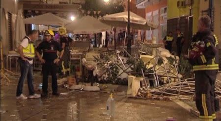 Police and rescue services are pictured at the scene after a gas cylinder exploded in a cafe in Velez-Malaga, Spain October 1, 2016 in this still image taken from video. Wikono via Reuters TV