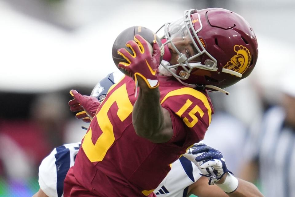 USC wide receiver Dorian Singer catches a pass against Nevada on Sept. 2.