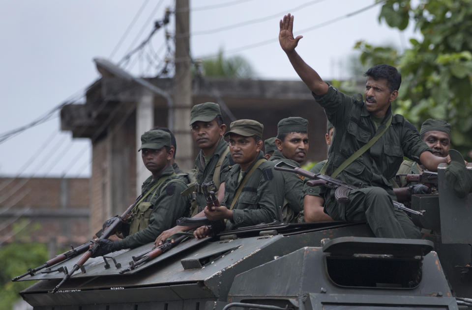 Soldiers return to their base following an operation searching for explosives and suspects tied to a local group of Islamic State militants in Kalmunai, Sri Lanka, Monday, April 29, 2019. The Catholic Church in Sri Lanka on Monday has urged the government to crack down on Islamic extremists with more vigor "as if on war footing" in the aftermath of the Easter bombings. (AP Photo/Gemunu Amarasinghe)