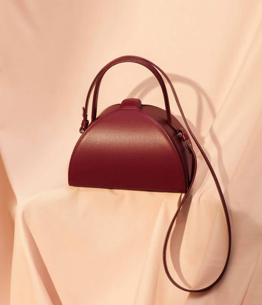 <p>Mlouye Pandora Bag in Burgundy, $495, <a rel="nofollow noopener" href="https://www.mlouye.com/collections/pandora-bag/products/pandora-bag-burgundy" target="_blank" data-ylk="slk:mlouye.com;elm:context_link;itc:0;sec:content-canvas" class="link ">mlouye.com</a> </p>