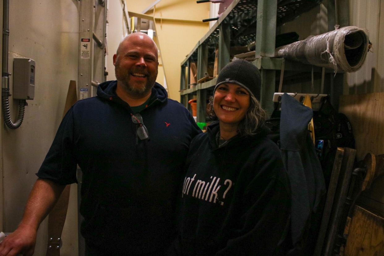 Adam Pratt, left, and Sarah Pratt stand near a cooler set between 38 and 42 degrees. They will spend approximately 90 hours in the cooler to complete this year's Kansas State Fair butter sculpture of Amelia Earhart.