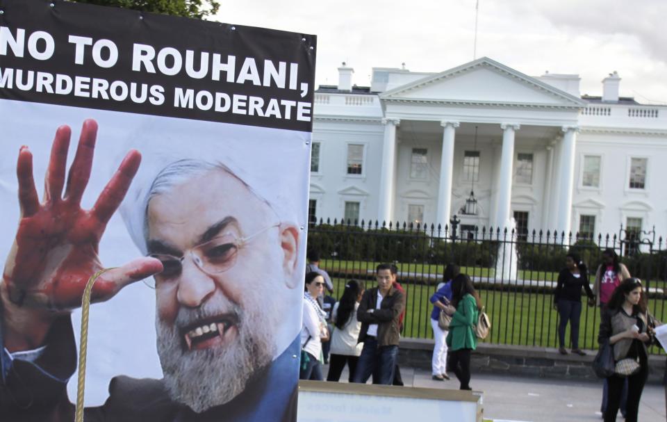 Iranian Americans protest against a conversation between U.S. President Barack Obama and new Iranian President Hassan Rouhani, outside the White House in Washington September 28, 2013. Obama and Rouhani spoke by telephone on Friday, the highest-level contact between the two countries in three decades and a sign that they are serious about reaching a pact on Tehran's nuclear program. REUTERS/Yuri Gripas (UNITED STATES - Tags: POLITICS CIVIL UNREST)