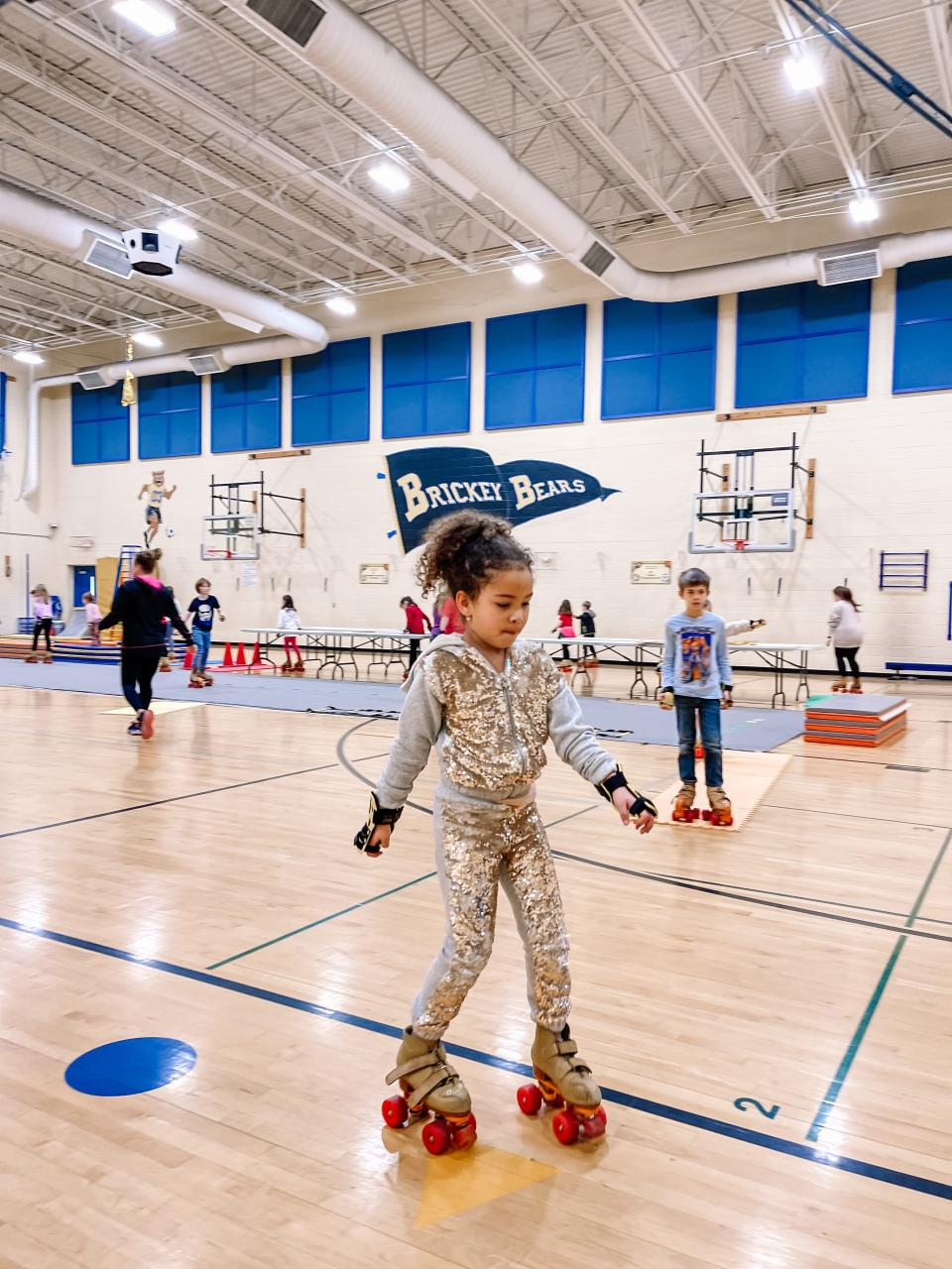 Second graders practice their roller skating in gym class at Brickey Elementary School on Feb. 2, 2023.