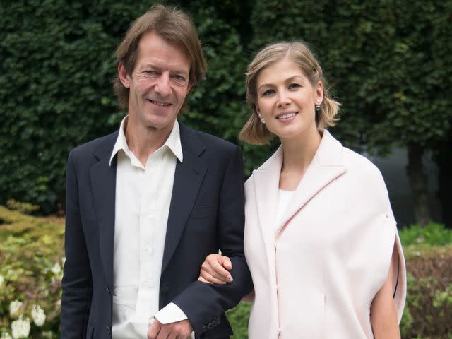 <p>Kirstin Sinclair/Getty</p> Rosamund Pike and Robie Uniacke during the Paris Haute Couture Fashion Week Autumn/Winter 2014 on July 7, 2014 in Paris, France