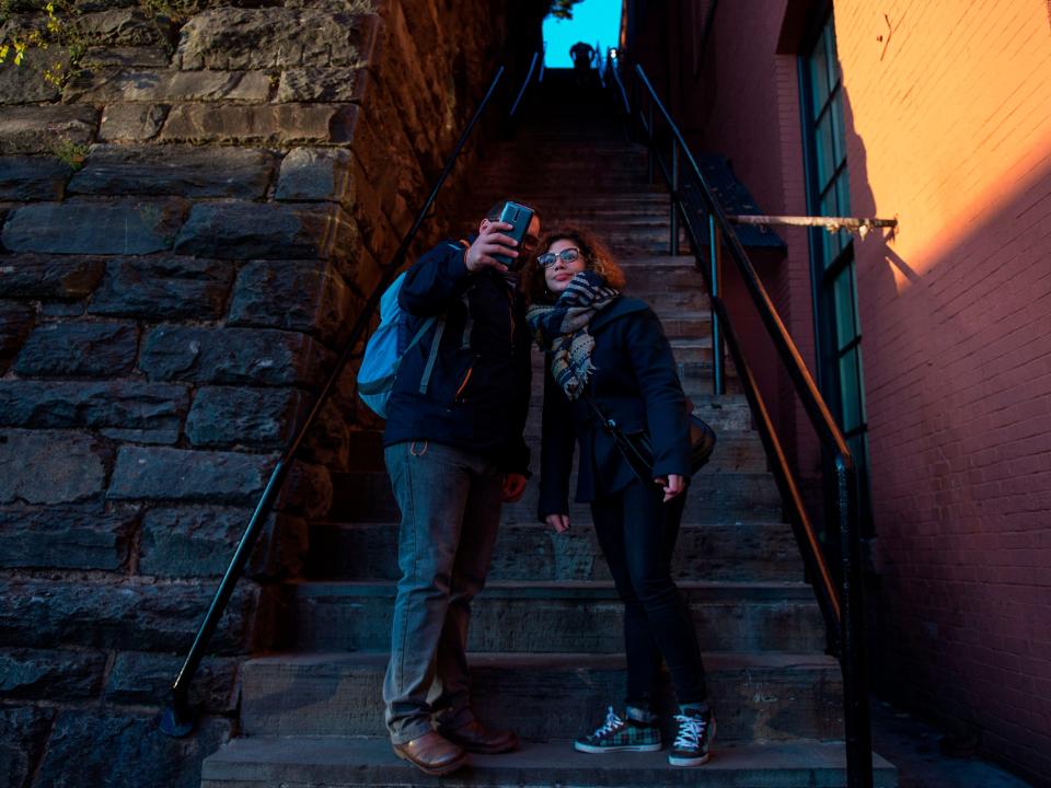 Tourists pose at the famous staircase from "The Exorcist."