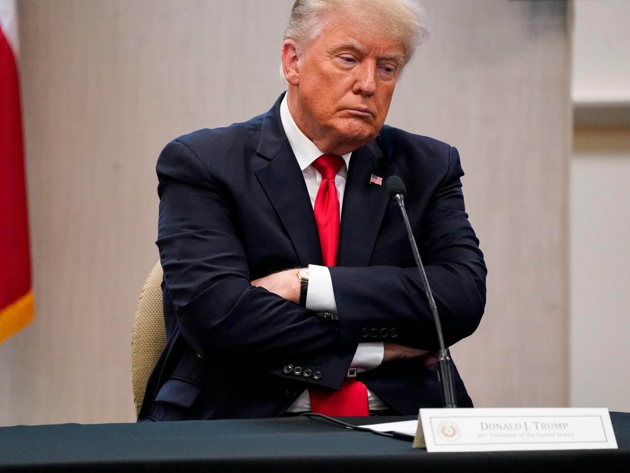 Former President Donald Trump attends a security briefing with Texas Gov. Greg Abbott, state officials and law enforcement at the Weslaco Texas Department of Public Safety (DPS) headquarters before touring the U.S.-Mexico border wall on Wednesday, June 30, 2021 (AP)