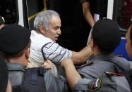 Police detain former world chess champion and opposition leader Garry Kasparov (C) during the trial of the female punk band "Pussy Riot" outside a court building in Moscow, August 17, 2012.