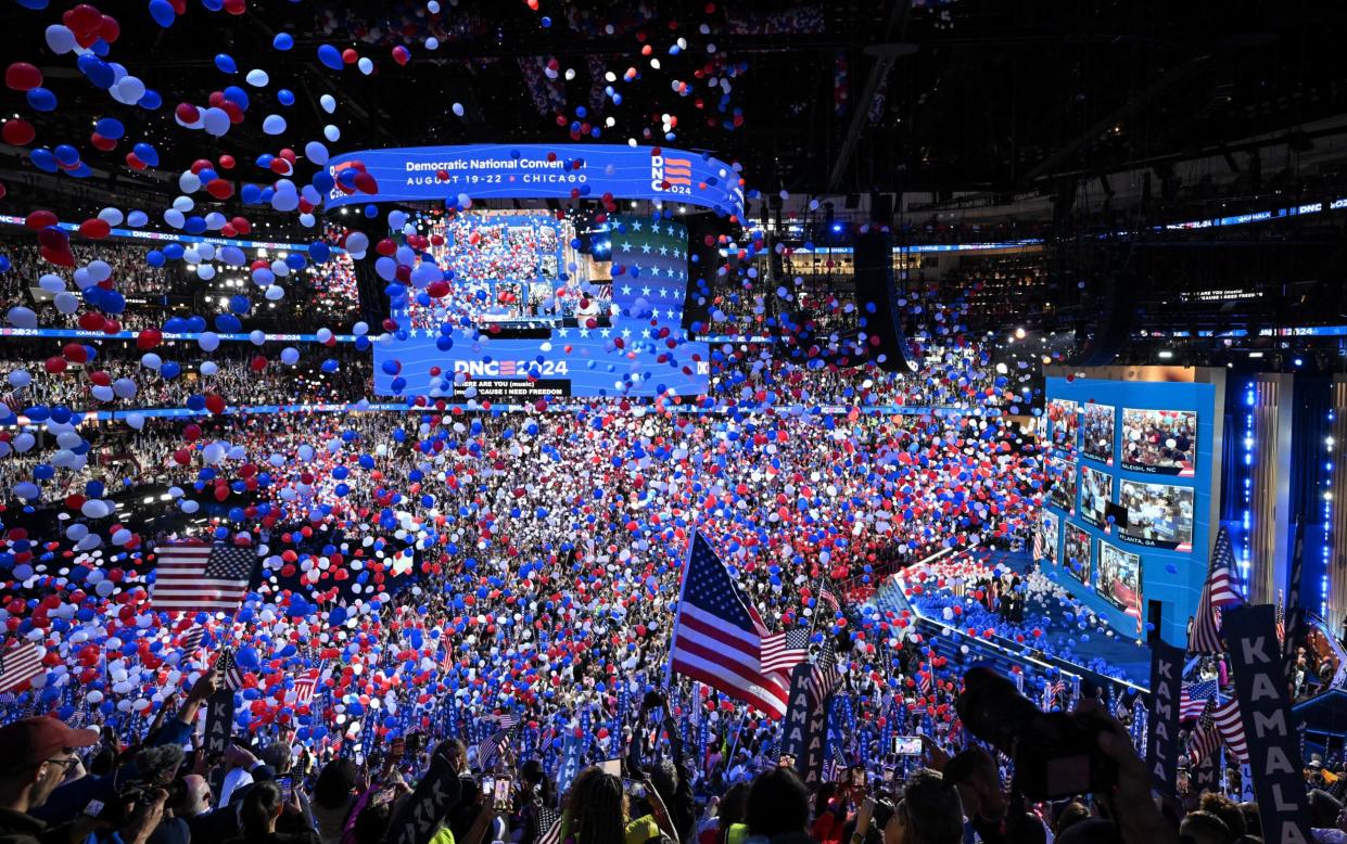 Confetti-filled balloons fall as Kamala Harris concludes her speech