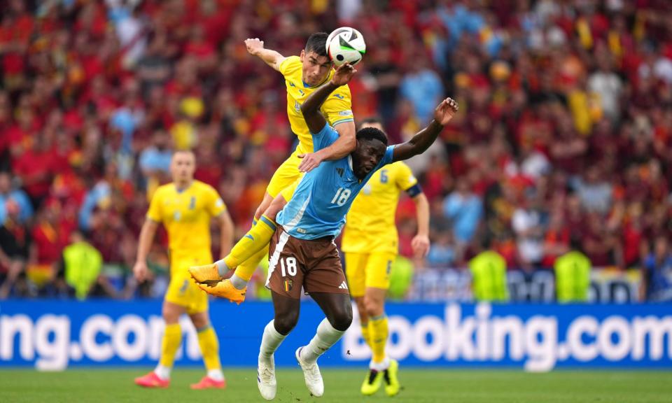 <span>Ruslan Malinovskyi of Ukraine competes for a header with Orel Mangala of Belgium in their goalless draw.</span><span>Photograph: Álex Caparrós/Uefa/Getty Images</span>