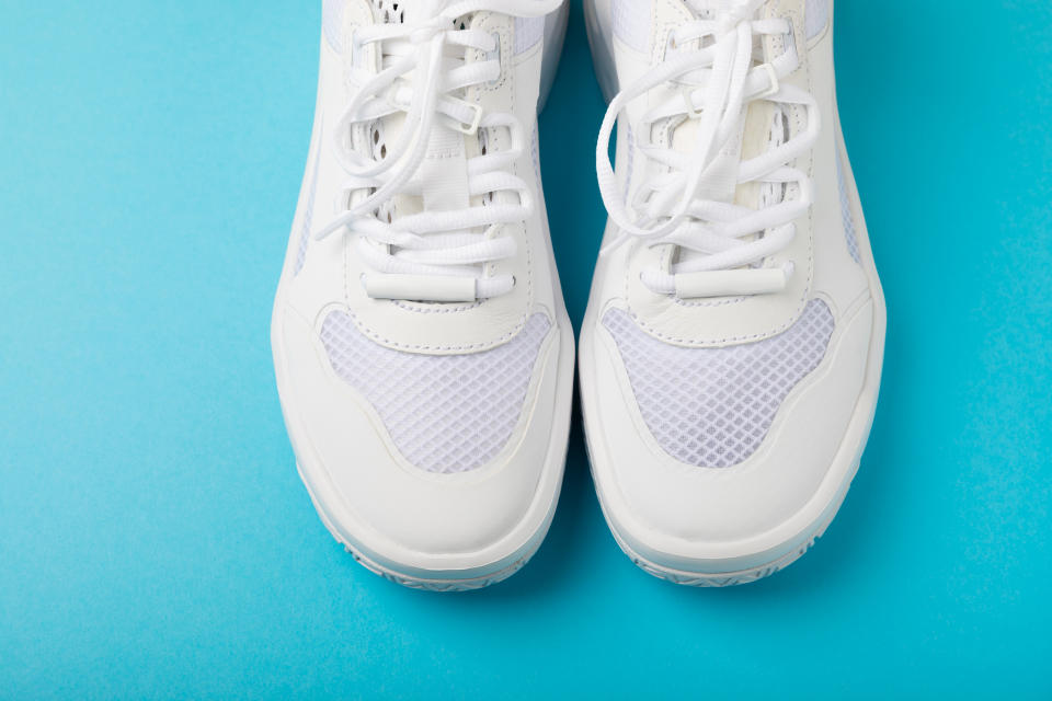 White sneakers on a colored background