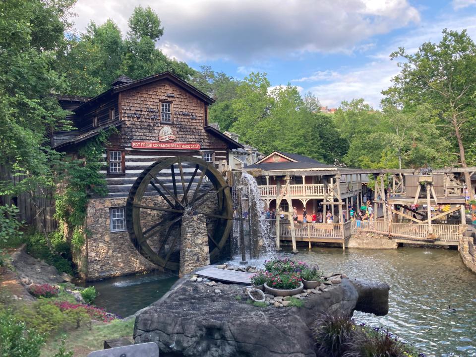 The Grist Mill at Dollywood with a water wheel and wooden structures