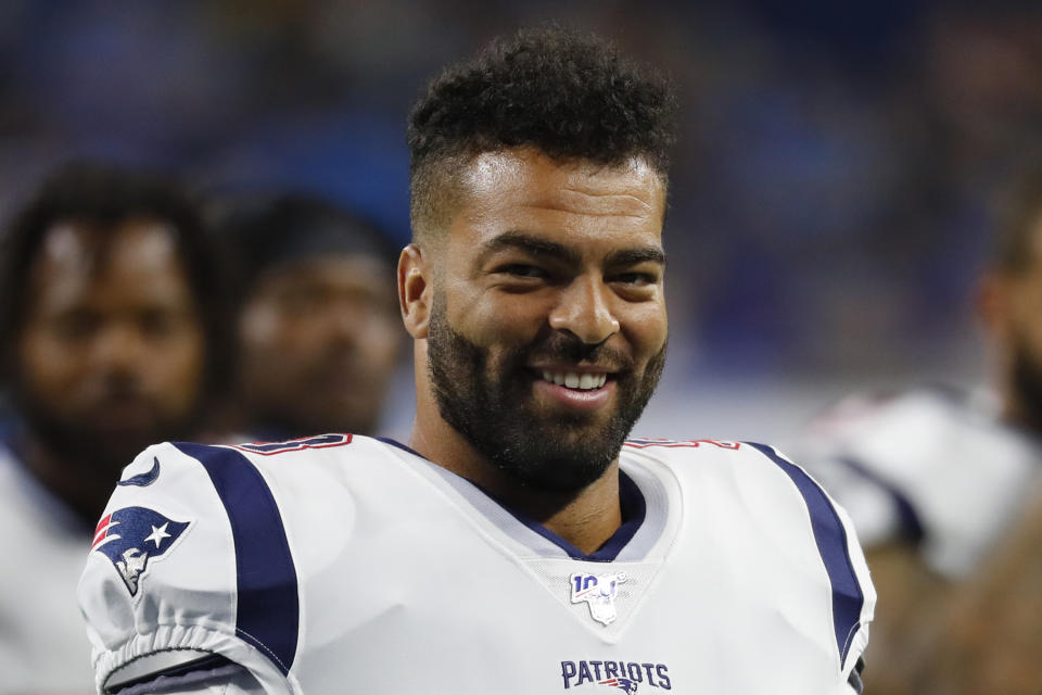 FILE - In this Aug. 8, 2019, file photo, New England Patriots middle linebacker Kyle Van Noy smiles on the field during an NFL preseason football game against the Detroit Lions in Detroit. The Miami Dolphins have added up to seven starters with a spending spree at the start of free agency, including linebacker Kyle Van Noy. (AP Photo/Paul Sancya, File)