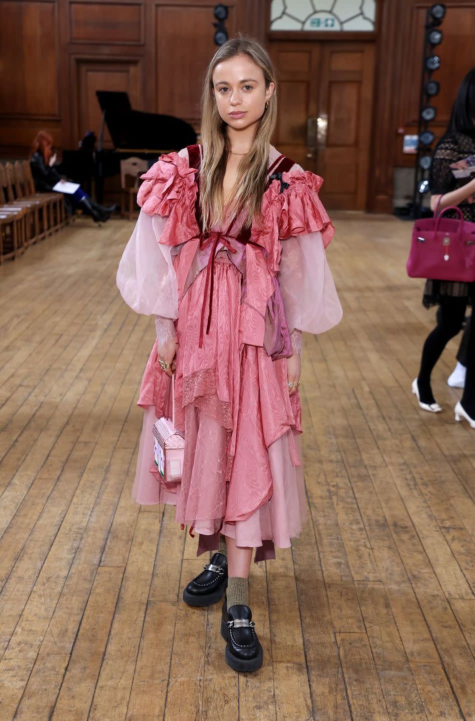 a woman wearing a pink dress