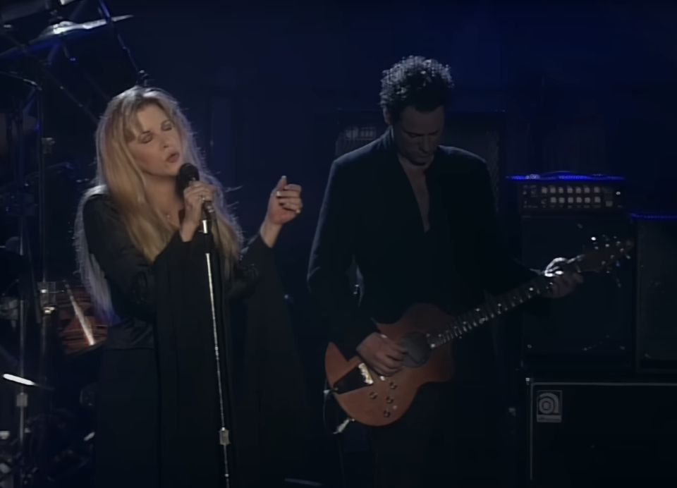 Singer Stevie Nicks on stage with Lindsey Buckingham on guitar