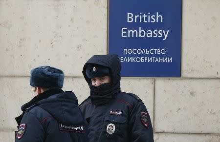 Russian policemen walk outside the British embassy in Moscow, Russia, March 17, 2018. REUTERS/David Mdzinarishvili