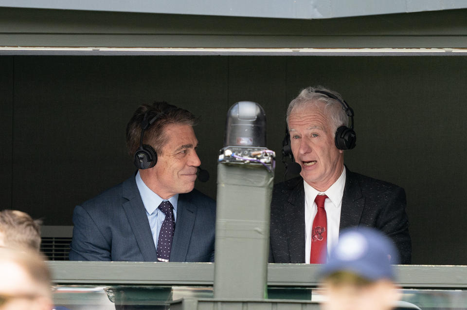 John McEnroe, seen here with ESPN's Chris Fowler at Wimbledon earlier this year, tested positive for COVID-19 and will miss part of the network's US Open coverage.