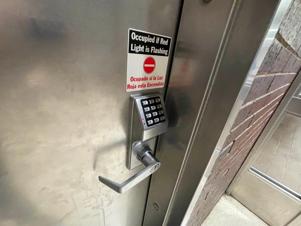 A locked door between the men’s and women’s bathrooms on the second floor of the Midtown terminal is labeled “All Gender Restroom” and includes a number to call for access. Helayne Seidman