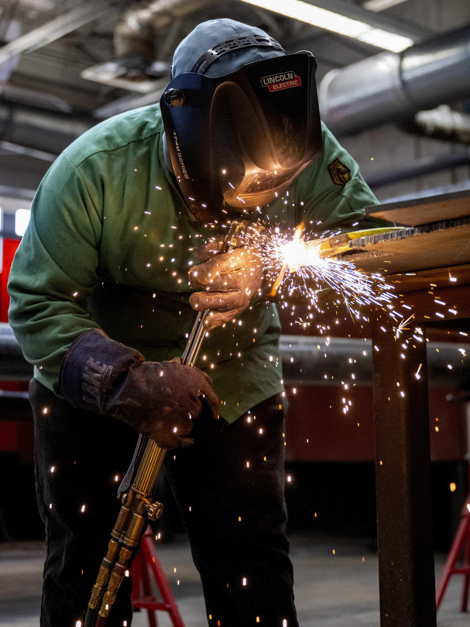 K'Jan Mason, a student of Hendry County Adult Learning participating in the welding program, continues to perfect his skills during his class project on Thursday, March 14 ,2024. The program helps adults gain the necessary experience to receive certification and immediately enter the local workforce after completion in Clewiston, Fla. (AP Photo/Chris Tilley)