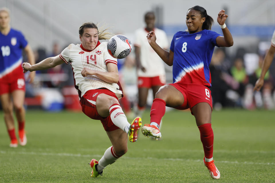 Canada's Vanessa Gilles, left, and United States' Jaedyn Shaw try to kick the ball during the first half of a SheBelieves Cup soccer match Tuesday, April 9, 2024, in Columbus, Ohio. (AP Photo/Jay LaPrete)