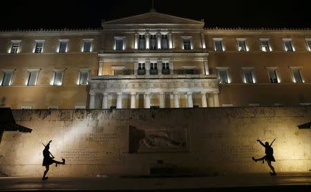 Greek Presidential Guardsmen 'Evzones' march during an anti-austerity, pro-government demonstration outside the Greek parliament in Athens on the eve of a crucial euro zone finance minister's meeting to discuss the country's future, February 11, 2015. REUTERS/Yannis Behrakis