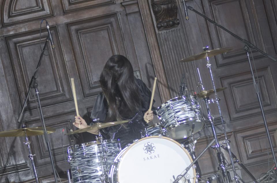 A model plays the drums during the finale of the Adeam Fall/Winter 2017 show.