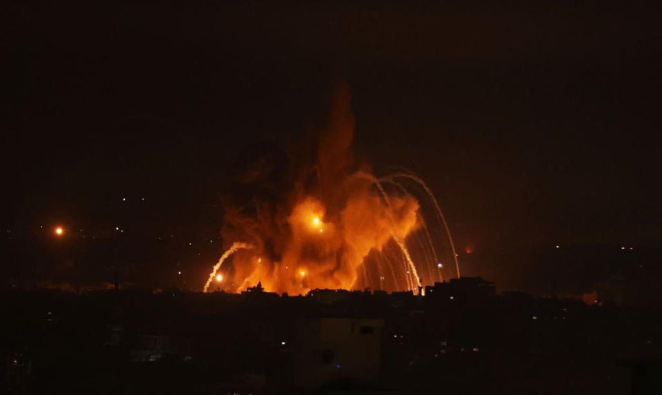 Smoke and flames rise on the Gaza Strip after being attacked by Israeli forces on Sunday.
