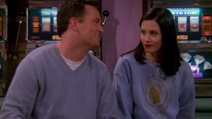 Chandler and Monica looking lovingly at one another in a scene from Friends.