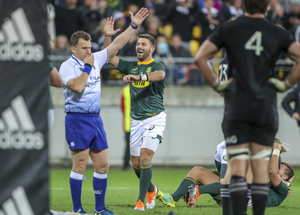 South Africa's players celebrate their win in a rugby championship test match between South Africa and New Zealand in Wellington, New Zealand, Saturday, Sept. 15, 2018. (AP Photo/John Cowpland)