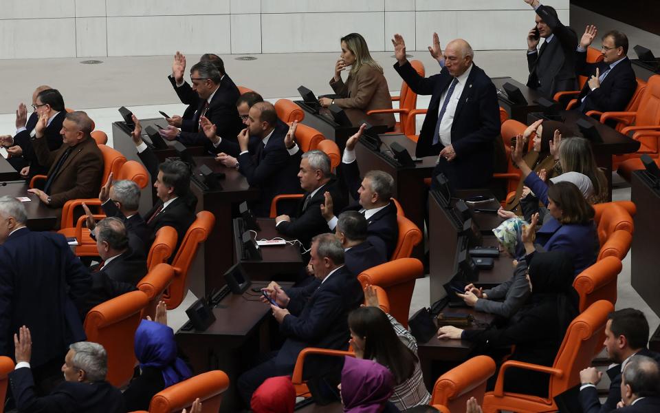 Turkish lawmakers vote in favor to approve Finland's application to join NATO,  in the Turkish parliament on March 30, 2023.