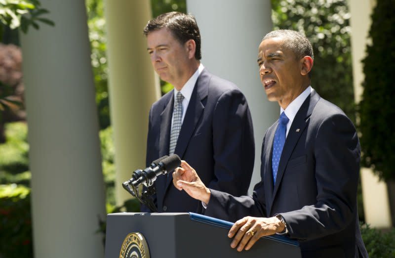 President Barack Obama (R) delivers remarks alongside James Comey, his nominee to be the next FBI Director, during a ceremony in the Rose Garden at the White House on June 21, 2013. File Photo by Kevin Dietsch/UPI