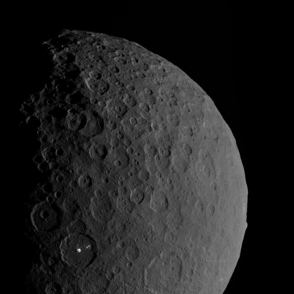 The dwarf planet Ceres as seen by NASA's Dawn spacecraft in orbit. This image, which shows the bright spots of Occator Crater, was taken Feb. 11, 2017. <cite>NASA/JPL-Caltech/UCLA/MPS/DLR/IDA</cite>