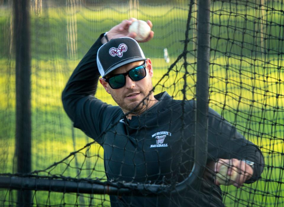 Worcester Academy baseball coach Mike Abraham throws batting practice Thursday at Gaskill Field.